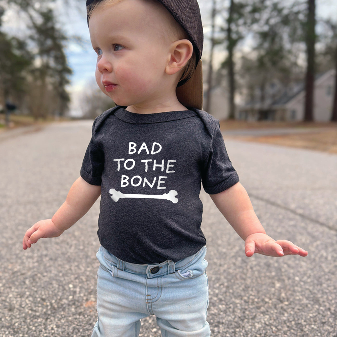 bad to the bone skeleton bone print on dark grey baby onesie