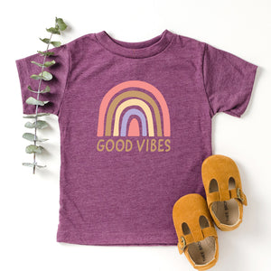 Good Vibes Rainbow Toddler Shirt - Heather Maroon Short Sleeve Toddler Tee with pastel pink, tan, beige and purple rainbow and good vibes print